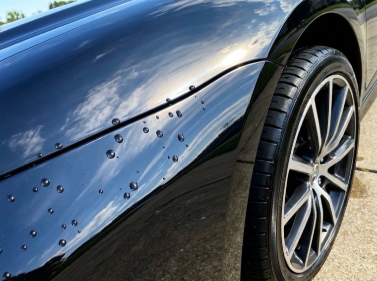 Glossy exterior paint with water beading after an exterior detail